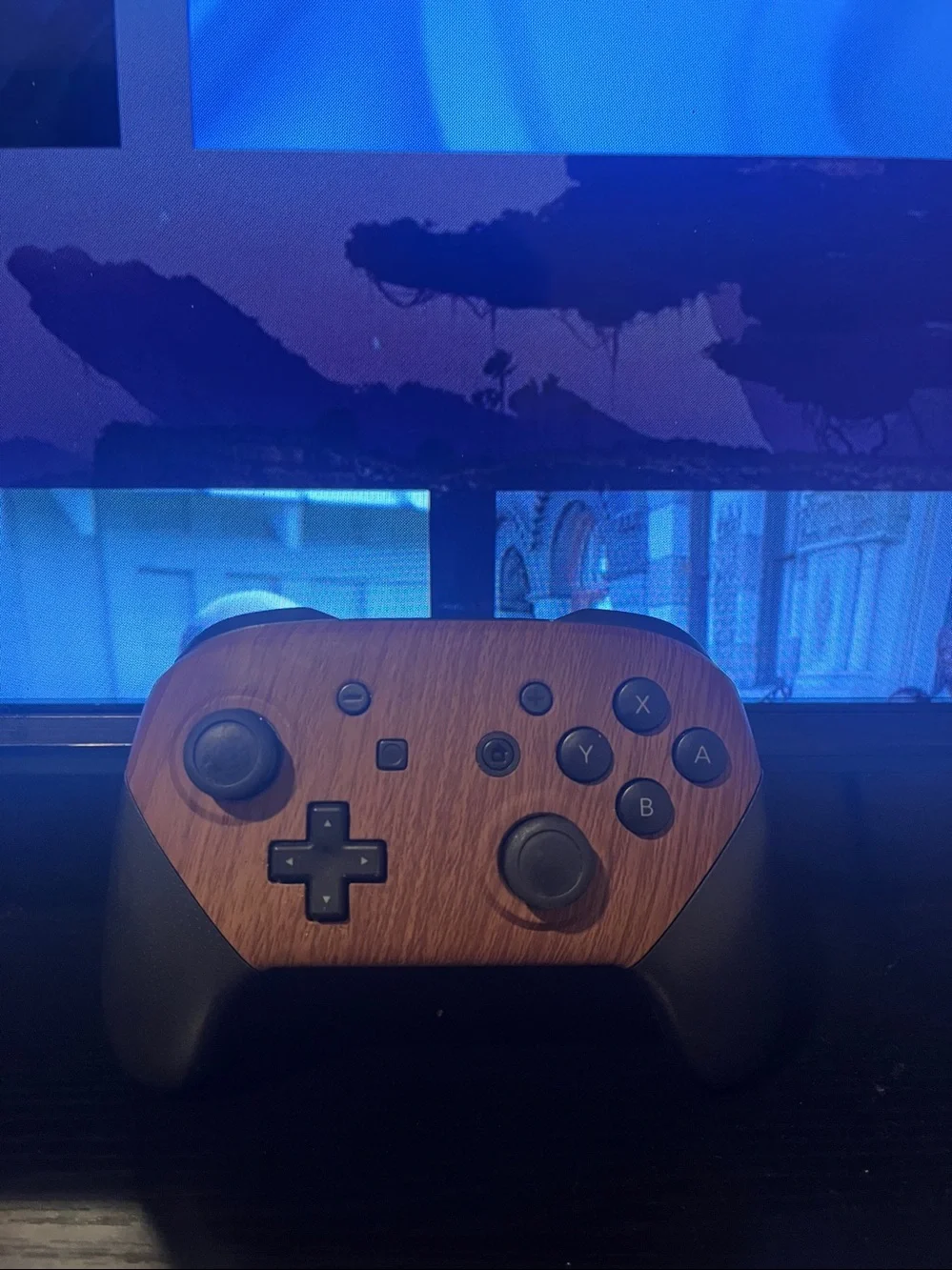 Nintendo Switch Pro Controller featuring a customized wood-grain